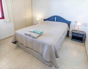 Łóżko lub łóżka w pokoju w obiekcie Inftour Amatista 9 Apartamento