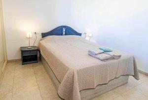 Łóżko lub łóżka w pokoju w obiekcie Inftour Amatista 9 Apartamento