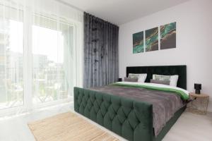Posteľ alebo postele v izbe v ubytovaní Cozy Studio Żupnicza Soho Factory by Noclegi Renters