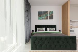 Posteľ alebo postele v izbe v ubytovaní Cozy Studio Żupnicza Soho Factory by Noclegi Renters