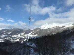 a train traveling down a snow covered mountain at appartement 8 couchages au lioran rando vtt ski in Le Lioran