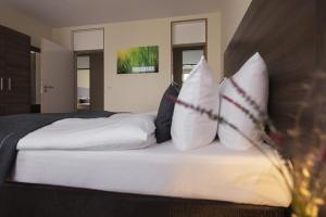 Ein Bett oder Betten in einem Zimmer der Unterkunft acora City Apart Living the City - Apartments