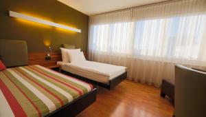 Ein Bett oder Betten in einem Zimmer der Unterkunft Hotel Belair