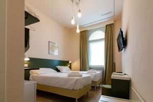 A bed or beds in a room at Migliori Olive Ascolane beds