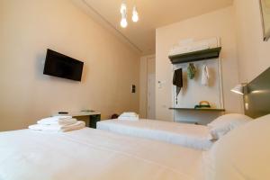 A bed or beds in a room at Migliori Olive Ascolane beds