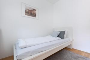 Posteľ alebo postele v izbe v ubytovaní Cozy 3-bedroom Apartment in the Heart of Budapest