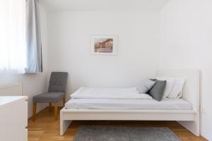 Posteľ alebo postele v izbe v ubytovaní Cozy 3-bedroom Apartment in the Heart of Budapest
