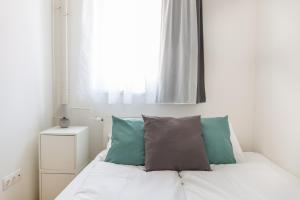 Posteľ alebo postele v izbe v ubytovaní Cozy 3-bedroom Apartment in the Heart of Budapest