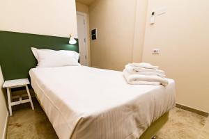 A bed or beds in a room at Migliori Olive Ascolane beds