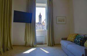 A television and/or entertainment centre at Migliori Olive Ascolane beds