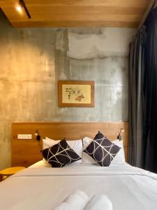 A bed or beds in a room at Chaos Boutique Hotel Kuala Lumpur