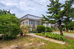 a house with a pathway in front of it at AVHC23 Beach Box in Avon