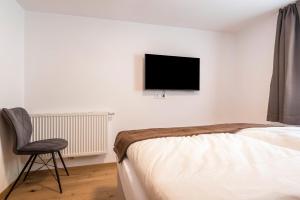 A television and/or entertainment centre at Sparberhof Apt Floriani
