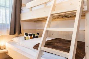 A bed or beds in a room at Sparberhof Apt Floriani