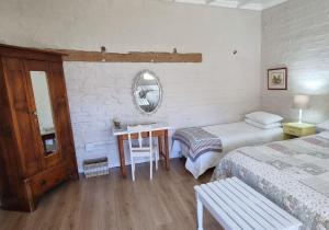 Postel nebo postele na pokoji v ubytování Rietjiesbos Self Catering