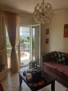 a living room with a couch and a table at Dream Nikiti xalkidikis in Nikiti +37 photos