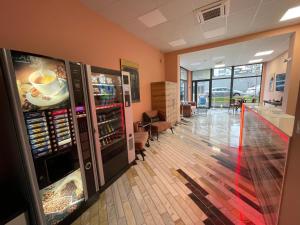 an office lobby with a drink refrigerator and a hallway at WOW studios for rent 2 bul Montevideo 25A - B in Sofia