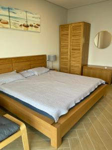 Giường trong phòng chung tại ARIA RESORT-2&3BEDS Apartment,hồ bơi và bãi biển miễn phí,50m