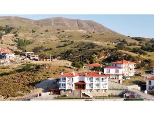 a group of houses on top of a hill at Estia Hotel in Gokceada Town