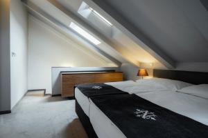 Postel nebo postele na pokoji v ubytování Hotel NOIR
