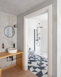 a bathroom with a shower and a sink at Re Versiliana Hotel in Marina di Pietrasanta