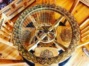 an overhead view of a wooden spiral staircase at Eco Yourte Les Airelles in Saint-Anthème