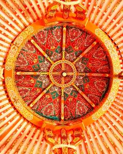 a close up of a colorful ceiling in a building at Eco Yourte Les Airelles in Saint-Anthème