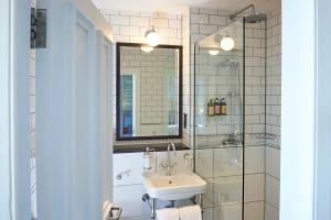 a bathroom with a sink and a glass shower at Hotel Du Vin, St Andrews in St. Andrews
