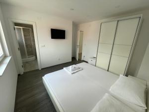 Postel nebo postele na pokoji v ubytování Apartments Vinko