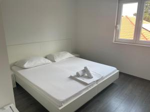 Postel nebo postele na pokoji v ubytování Apartments Vinko