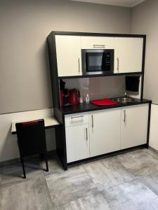 Kuchyň nebo kuchyňský kout v ubytování Garni Hotel Eastside
