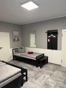 Postel nebo postele na pokoji v ubytování Garni Hotel Eastside