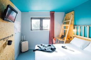 Postel nebo postele na pokoji v ubytování Birgit Hôtel Le Havre Centre
