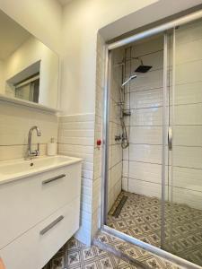 a bathroom with a shower and a sink at Ikigai Hotel Villa Rıfat in Adalar +119 photos