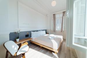 Posteľ alebo postele v izbe v ubytovaní Agora Athens Suites