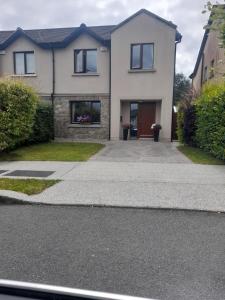 a large white house with a driveway at 112 Roseberry Hill in Newbridge