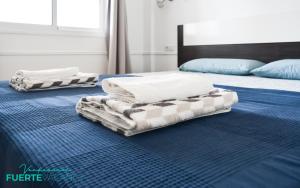 Postel nebo postele na pokoji v ubytování VERDEMAR Digital by Rentalfue