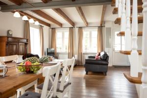 a kitchen and living room with a table and chairs at Großer Feldblick in Hinrichsdorf