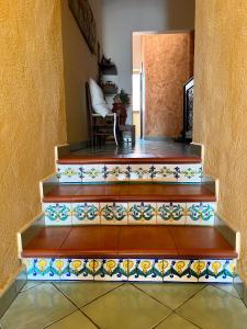 a set of stairs with colorful tiles on them at B&B Alfrantoio Valderice in Valderice
