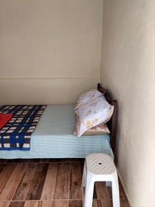 Säng eller sängar i ett rum på Pousada e Camping Daniel