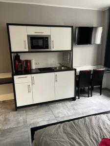 Kuchyň nebo kuchyňský kout v ubytování Garni Hotel Eastside
