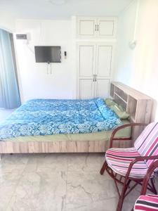 Кровать или кровати в номере Villa Bougainville Touriste Résidence