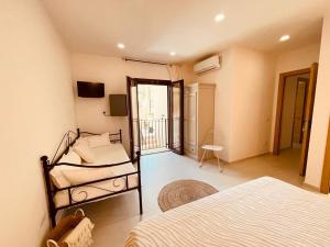 Postel nebo postele na pokoji v ubytování B&B Dimora Dorgali
