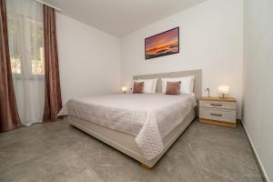 Кровать или кровати в номере Apartments Horvat