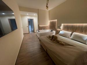 a bedroom with a large bed and a sink at JSK Suite in Rome