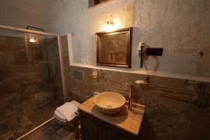 A bathroom at Avanos Suites