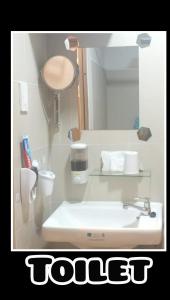 Ванна кімната в Jk Coastal Inn