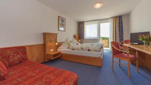 En eller flere senge i et værelse på Gasthof Krone Hotel & Restaurant