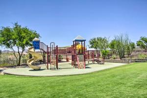 a playground with a slide in a park at North Phoenix Home with Community Pools! in Anthem