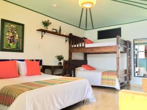 Postel nebo postele na pokoji v ubytování Mamatina Hotel